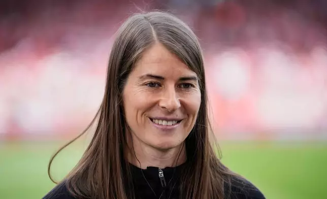 New head coach of German Bundesliga soccer club 1. FC Union Berlin Marie-Louise Eta looks on during the warm up prior to the German Bundesliga soccer match between FC Union Berlin and Wolfsburg in Berlin, Germany, Saturday, April 18, 2026. (AP Photo/Ebrahim Noroozi)