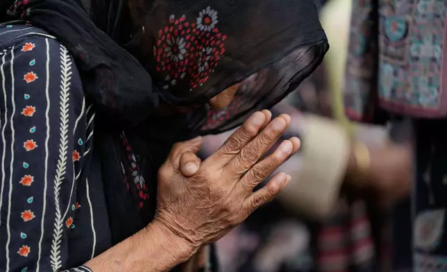 An Indian Christian devotee pray during a procession to mark Good Friday in Jammu, India, Friday, April 3, 2026.(AP Photo/Channi Anand)
