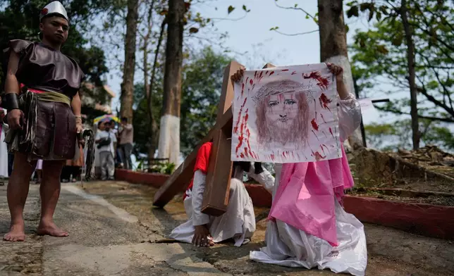 Christians reenact the crucifixion of Jesus Christ in Guwahati, India, on Good Friday, April 3, 2026. (AP Photo/Anupam Nath)