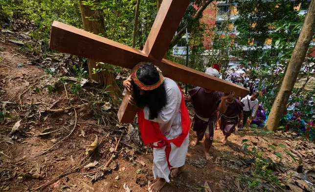 Christians reenact the crucifixion of Jesus Christ in Guwahati, India, on Good Friday, April 3, 2026. (AP Photo/Anupam Nath)