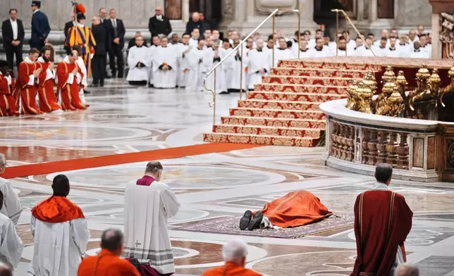 Pope Leo XIV attends the Celebration of the Passion of the Lord in St. Peter's Basilica at the Vatican on Catholic Good Friday, Friday, April 3, 2026 (AP Photo/Andrew Medichini)