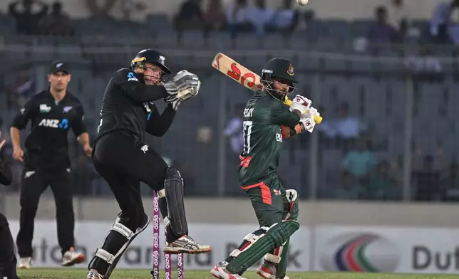 Bangladesh's Tawhid Hridoy plays a shot during the second one day international cricket match between Bangladesh and New Zealand in Mirpur, Bangladesh, Monday, April 20, 2026. (AP Photo/Mosaraf Hossain)