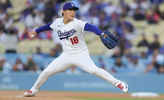 Los Angeles Dodgers starting pitcher Yoshinobu Yamamoto delivers during the first inning of a baseball game against the Miami Marlins, Monday, April 27, 2026, in Los Angeles. (AP Photo/Ryan Sun)