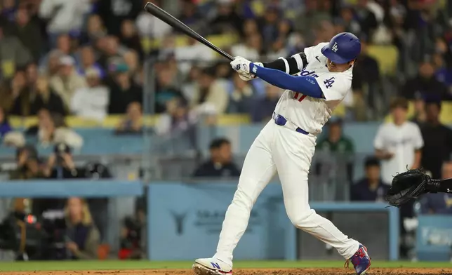 Los Angeles Dodgers designated hitter Shohei Ohtani grounds out to Miami Marlins first baseman Connor Norby during the fifth inning of a baseball game Monday, April 27, 2026, in Los Angeles. (AP Photo/Ryan Sun)
