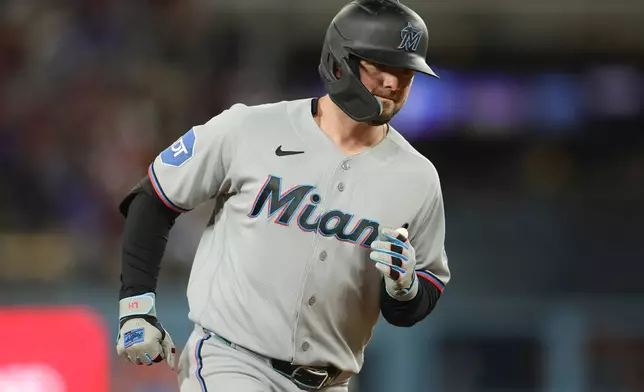 Miami Marlins designated hitter Liam Hicks runs the bases after hitting a three-run home run during the fifth inning of a baseball game against the Los Angeles Dodgers Monday, April 27, 2026, in Los Angeles. (AP Photo/Ryan Sun)