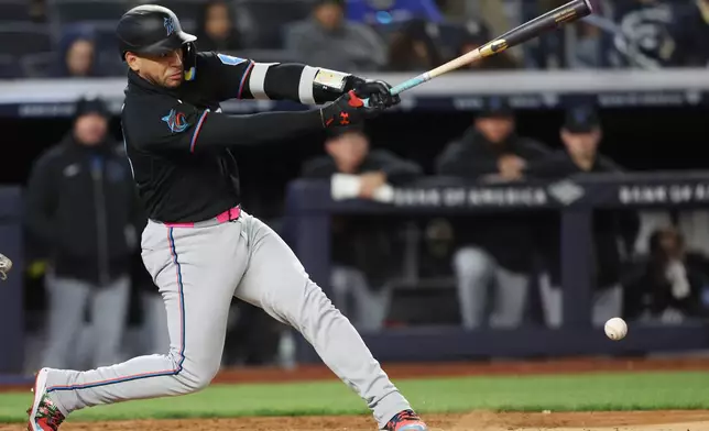 Miami Marlins catcher Agustín Ramírez connects for a single during the fourth inning of a baseball game against the New York Yankees, Saturday, April 4, 2026, in New York. (AP Photo/Heather Khalifa)