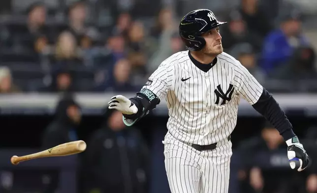 New York Yankees' Cody Bellinger tosses his bat after a home run during the fifth inning of a baseball game against the Miami Marlins, Saturday, April 4, 2026, in New York. (AP Photo/Heather Khalifa)