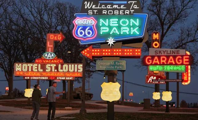 Terry and Christie Partee visit Route 66 Neon Park inside George M. Reed Roadside Park along historic Route 66 in St. Robert, Mo., Tuesday, Nov. 18, 2025. (AP Photo/Jeff Roberson)