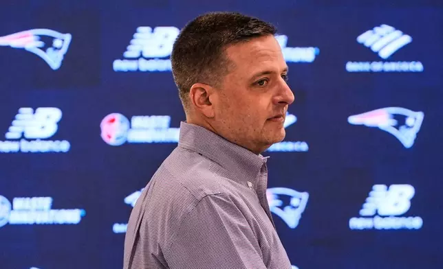 Eliot Wolf, the New England Patriots Executive Vice President of Player Personnel, walks to the podium during an NFL football media availability, Monday, April 13, 2026, in Foxborough, Mass. (AP Photo/Charles Krupa)