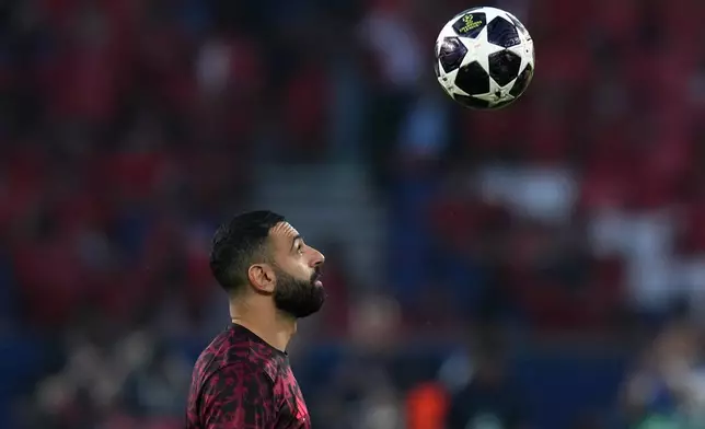Liverpool's Mohamed Salah controls the ball during warm up before the Champions League quarterfinal first leg soccer match between Paris Saint-Germain and Liverpool in Paris, Wednesday, April 8, 2026. (AP Photo/Thibault Camus)