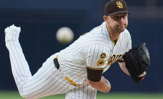 San Diego Padres starting pitcher Michael King works against a Seattle Mariners batter during the first inning of a baseball game Tuesday, April 14, 2026, in San Diego. (AP Photo/Gregory Bull)