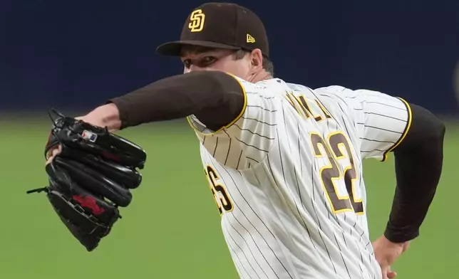 San Diego Padres pitcher Mason Miller works against a Seattle Mariners batter during the ninth inning of a baseball game Tuesday, April 14, 2026, in San Diego. (AP Photo/Gregory Bull)