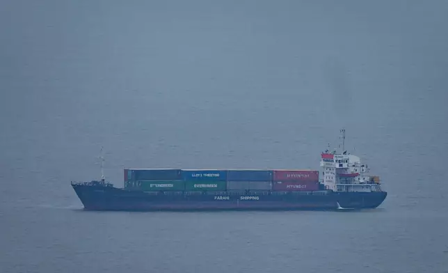 A cargo ship sails in the Persian Gulf towards Dubai port as seen from Ajman, United Arab Emirates, Tuesday, April 14, 2026. (AP Photo)