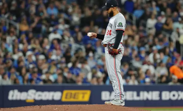 Minnesota Twins pitcher Simeon Woods Richardson reacts on the mound during fourth-inning baseball game action against the Toronto Blue Jays in Toronto, Friday, April 10, 2026. (Chris Young/The Canadian Press via AP)