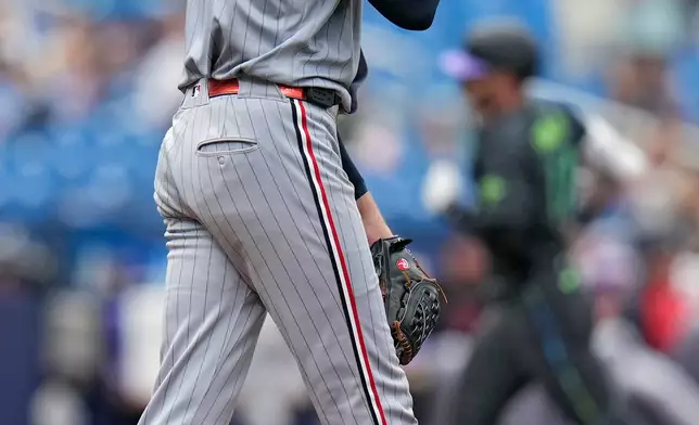 Minnesota Twins pitcher Bailey Ober reacts as Tampa Bay Rays' Jake Fraley runs the bases following his two-run home run during the fourth inning of a baseball game Saturday, April 25, 2026, in St. Petersburg, Fla. (AP Photo/Chris O'Meara)