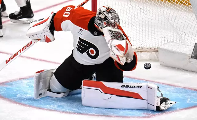 A shot by Pittsburgh Penguins' Elmer Soderblom gets past Philadelphia Flyers goaltender Dan Vladar (80) for a goal during the first period of Game 5 in the first round of an NHL hockey Stanley Cup playoff series in Pittsburgh, Monday, April 27, 2026. (AP Photo/Gene J. Puskar)