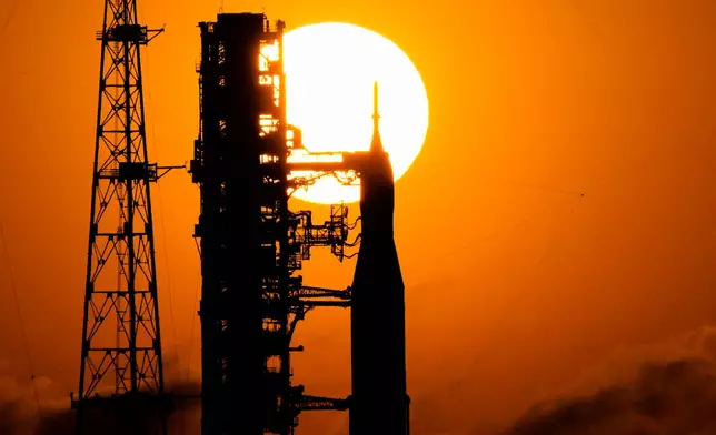 NASA's Space Launch System rocket with the Orion spacecraft set for the Artemis 2 mission is seen on Launch Complex 39B at sunrise at the Kennedy Space Center, Tuesday, March 24, 2026, in Cape Canaveral, Fla. (AP Photo/John Raoux)