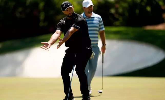 Jon Rahm, of Spain, reacts after missing a putt on the 13th hole during the second round of the Masters golf tournament at the Augusta National Golf Club, Friday, April 10, 2026, in Augusta, Ga. (AP Photo/Matt Slocum)