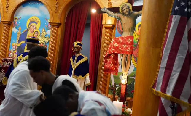 Deacons celebrate Good Friday at Re'ese Adbarat Debre Selam Kidist Mariam Church, an Ethiopian Orthodox Tewahedo church, in Washington, Friday, April 10, 2026. (AP Photo/Jessie Wardarski)