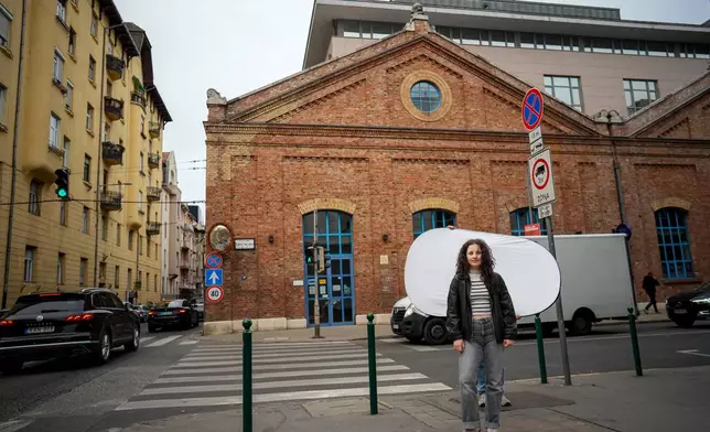 Mira Nagy, 19, poses for a portrait in Budapest, Hungary, Monday, April 13, 2026. "I listened a lot of podcasts, I did my research and I figured out that staying in power for sixteen years was not okay. That defeats the point of democracy. " (AP Photo/Petr David Josek)