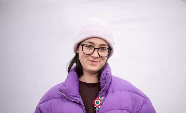 Eszter Kulisek M., 24, poses for a portrait in Budapest, Hungary, Monday, April 13, 2026. "I hope that young people will start participating in society; that they'll be more active in politics, that they'll take on our everyday challenges." (AP Photo/Petr David Josek)