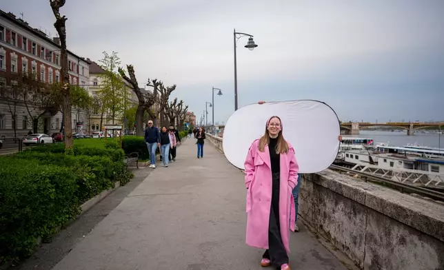 Eszter Tovai, 22, poses for a portrait in Budapest, Hungary, Monday, April 13, 2026. "It was our responsibility to talk to people and change their minds. I personally persuaded seven people to vote for change." (AP Photo/Petr David Josek)