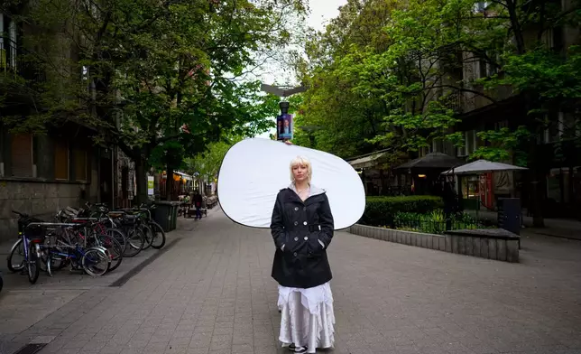 Andrea Anna Hajdu, 22, poses for a portrait in Budapest, Hungary, Monday, April 13, 2026. "This whole movement started with us, with student protests. They couldn't lead us on. We were hungry for change." (AP Photo/Petr David Josek)