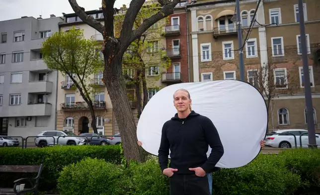 Patrik Gal, 23, poses for a portrait in Budapest, Hungary, Monday, April 13, 2026. "It's about getting a fresh start and seeing what it could bring for us." (AP Photo/Petr David Josek)