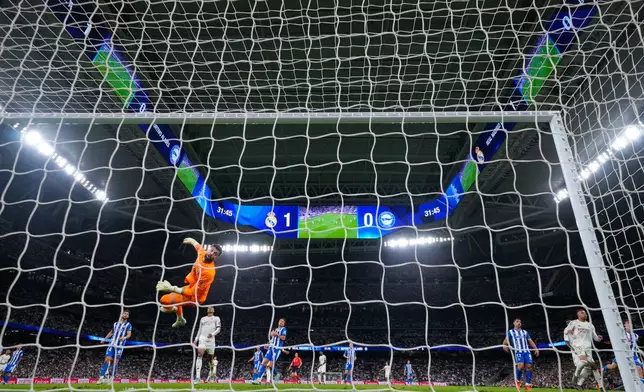 Alaves' goalkeeper Antonio Siverawatches ball go out of bounds during a La Liga soccer match between Real Madrid and Alaves in Madrid, Spain, Tuesday, April 21, 2026. (AP Photo/Manu Fernandez)