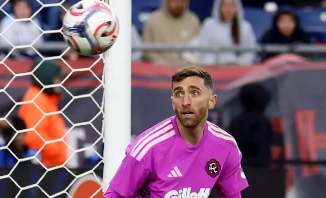 New England Revolution goalkeeper Matt Turner watches the ball sail by the net on a shot by CF Montreal in the second half of an MLS soccer match, Saturday, April 4, 2026, in Foxborough, Mass. (AP Photo/Mark Stockwell)