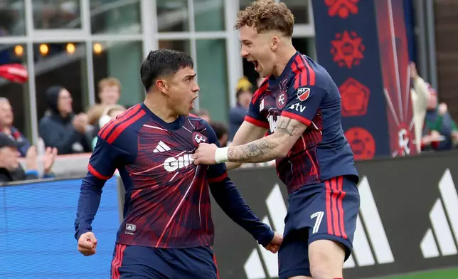 New England Revolution forward Luca Langoni (41) and teammate Griffin Yow (7) celebrate Langoni's goal in the first half of an MLS soccer match against CF Montreal, Saturday, April 4, 2026, in Foxborough, Mass. (AP Photo/Mark Stockwell)