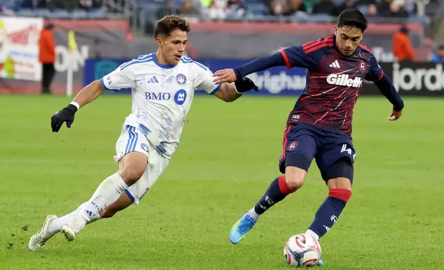 New England Revolution forward Luca Langoni, right, turns away from CF Montréal midfielder Wiki Carmona, left, in the second half of an MLS soccer match Saturday, April 4, 2026, in Foxborough, Mass. (AP Photo/Mark Stockwell)
