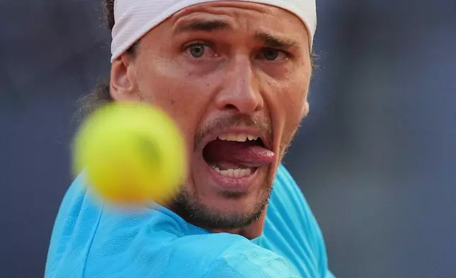 Alexander Zverev of Germany eyes the ball during his match against Terence Atmane of France during the Madrid Open tennis tournament in Madrid, Monday, April 27, 2026. (AP Photo/Manu Fernandez)