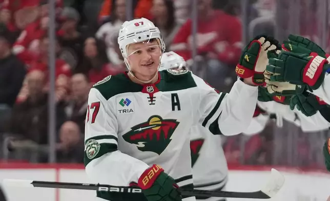 Minnesota Wild left wing Kirill Kaprizov celebrates his goal against the Detroit Red Wings in the second period of an NHL hockey game Sunday, April 5, 2026, in Detroit. (AP Photo/Paul Sancya)