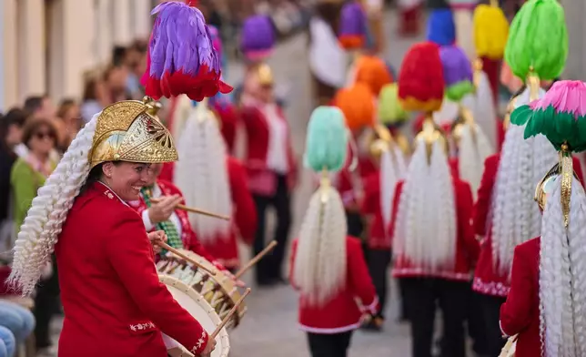 Members of the "White-tail Jews," march while playing drums alongside the Nuestro Padre Jesus del Huerto y San Diego brotherhood during a Holy Week procession in Baena, southern Spain, Wednesday, April 1, 2026. (AP Photo/Manu Fernandez)