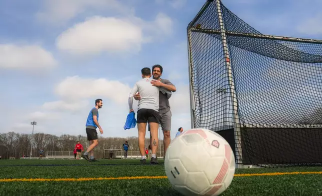 People play soccer at Stony Brook University in Stony Brook, N.Y., Friday, April 3, 2026. (AP Photo/Ryan Murphy)