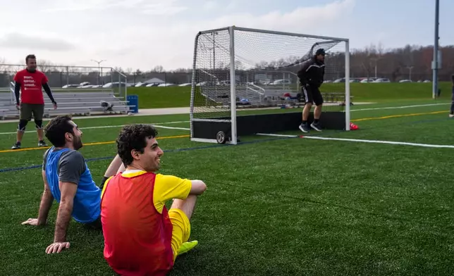 People play soccer at Stony Brook University in Stony Brook, N.Y., Friday, April 3, 2026. (AP Photo/Ryan Murphy)
