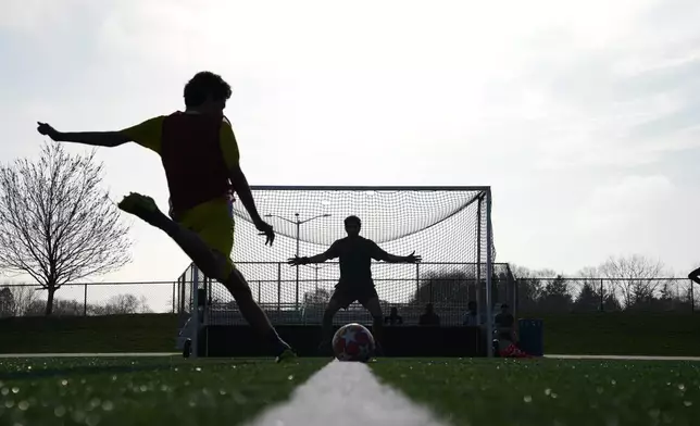 People play soccer at Stony Brook University in Stony Brook, N.Y., Friday, April 3, 2026. (AP Photo/Ryan Murphy)