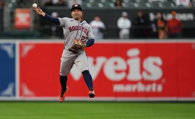 Houston Astros second baseman Jose Altuve (27) throws to first to make the out against Baltimore Orioles' Pete Alonso during the first inning of a baseball game, Tuesday, April 28, 2026, in Baltimore. (AP Photo/Stephanie Scarbrough)