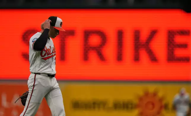 Baltimore Orioles starting pitcher Shane Baz returns to the dugout after striking out Houston Astros' Brice Matthews to retire the side during the second inning of a baseball game, Tuesday, April 28, 2026, in Baltimore. (AP Photo/Stephanie Scarbrough)