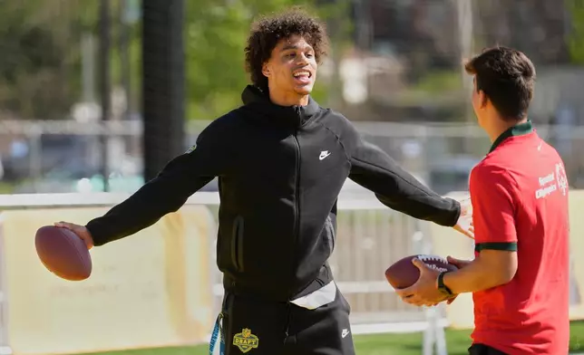 Jordyn Tyson, Arizona State wide receiver, works with local youth football players and Special Olympics athletes during the league's annual prospect clinic ahead of the NFL football draft Wednesday,April 22, 2026, in Pittsburgh. (AP Photo/Sue Ogrocki)