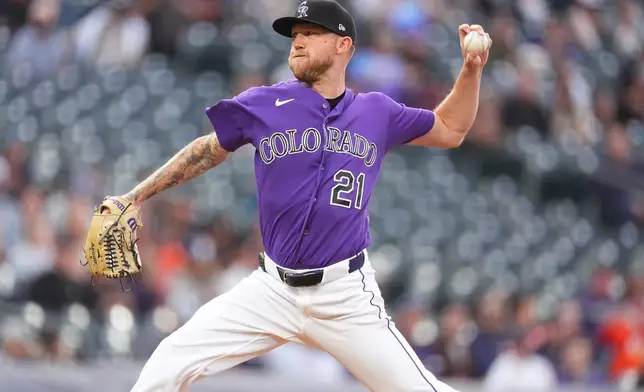 Colorado Rockies starting pitcher Kyle Freeland works against the Houston Astros in the first inning of a baseball game Tuesday, April 7, 2026, in Denver. (AP Photo/David Zalubowski)