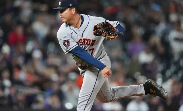 Houston Astros relief pitcher Kai-Wei Teng works against the Colorado Rockies in the seventh inning of a baseball game Tuesday, April 7, 2026, in Denver. (AP Photo/David Zalubowski)