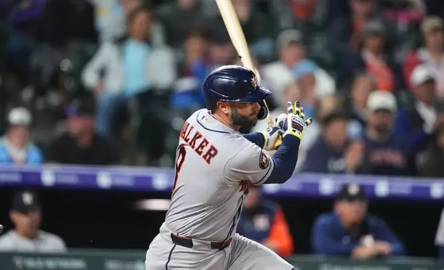 Houston Astros' Christian Walker grounds out against Colorado Rockies relief pitcher Antonio Senzatela to end a baseball game Tuesday, April 7, 2026, in Denver. (AP Photo/David Zalubowski)