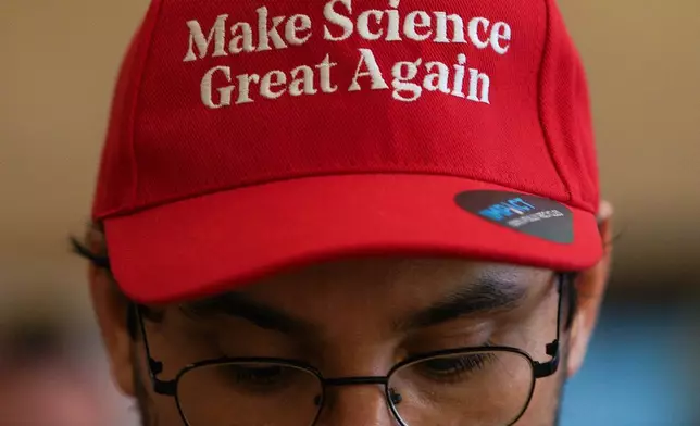 A man wears a hat that reads "Make Science Great Again" during a conference aimed at transitioning away from fossil fuels Wednesday, April 29, 2026, in Santa Marta, Colombia. (AP Photo/Ivan Valencia)