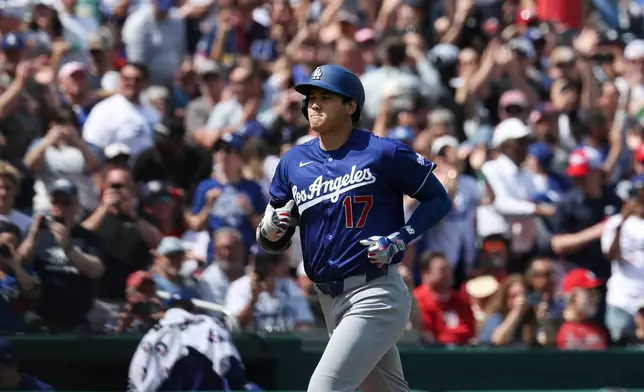 Los Angeles Dodgers' Shohei Ohtani (17) runs the bases after hitting a three-run home run during the third inning of an baseball game against the Washington Nationals, Friday, April 3, 2026, in Washington. (AP Photo/Terrance Williams)