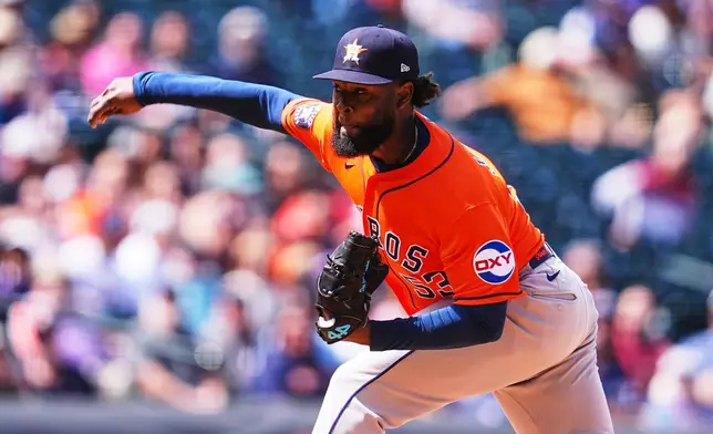 Houston Astros starting pitcher Cristian Javier works against the Colorado Rockies in the first inning of a baseball game Wednesday, April 8, 2026, in Denver. (AP Photo/David Zalubowski)