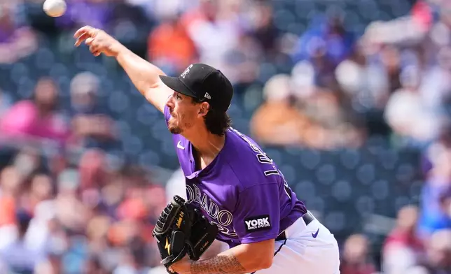 Colorado Rockies starting pitcher Michael Lorenzen works against the Houston Astros in the second inning of a baseball game Wednesday, April 8, 2026, in Denver. (AP Photo/David Zalubowski)
