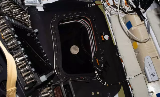 This image provided by NASA on Monday, April 6, 2026, shows a view of the moon taken by the Artemis II crew before going to sleep on flight day 5. (NASA via AP)