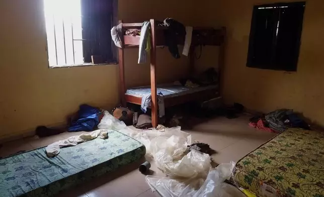 Students' belongings are seen inside a dormitory of an orphanage that was raided by gunmen late Sunday, in Lokoja, Nigeria, Monday, April 27, 2026. (AP Photo/Haruna Yahaya)